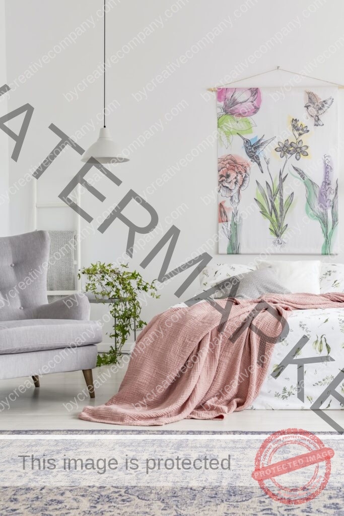 Cozy bedroom interior with a bed dressed in white and green shee